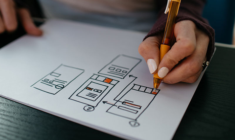 close up of person sketching wireframes